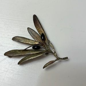 P11. Vintage floral pin with black beads.